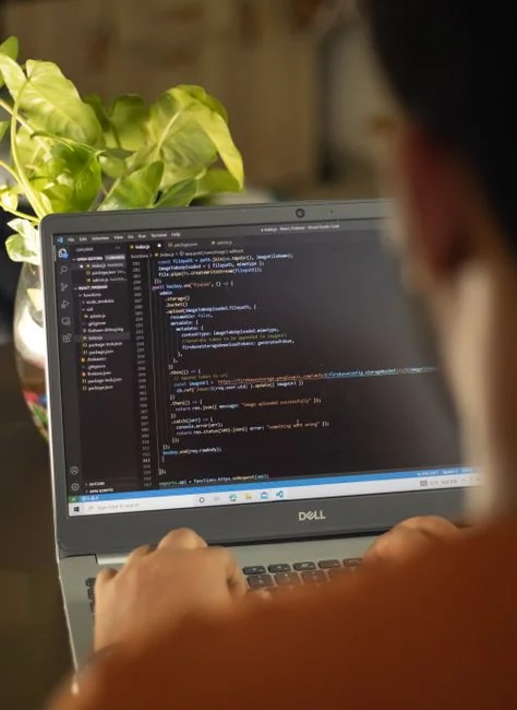 A well-organized design workspace with dual monitors and design software on display.